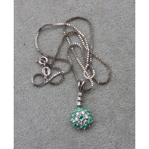 717 - An 18ct white gold drop pendant set with 9 various light green stones and matching 18ct white gold b... 