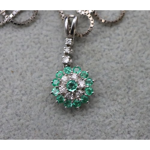 717 - An 18ct white gold drop pendant set with 9 various light green stones and matching 18ct white gold b... 