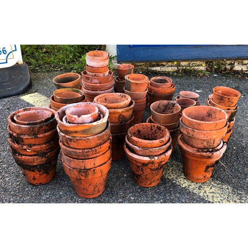 9001 - A large quantity of terracotta garden pots, ranging from 14cm high to 4cm high.