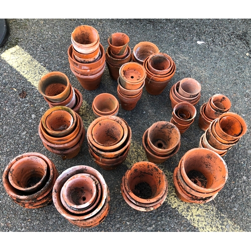 9001 - A large quantity of terracotta garden pots, ranging from 14cm high to 4cm high.