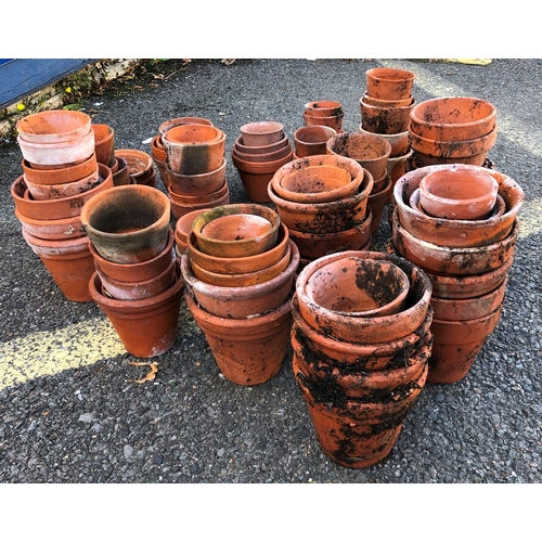 9001 - A large quantity of terracotta garden pots, ranging from 14cm high to 4cm high.