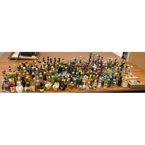 9002 - A large quantity of miniature bottles of alcohol, including, Whisky, Port, Vodka, Rum etc, mostly un... 