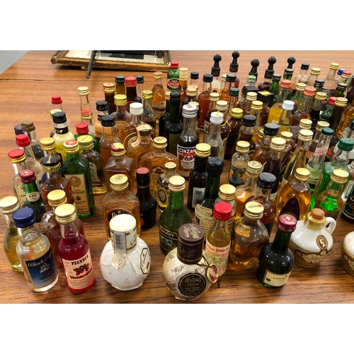 9002 - A large quantity of miniature bottles of alcohol, including, Whisky, Port, Vodka, Rum etc, mostly un... 