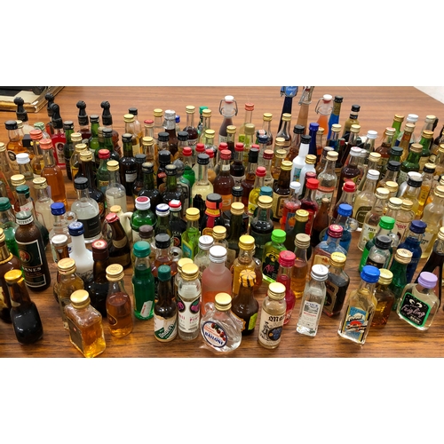 9002 - A large quantity of miniature bottles of alcohol, including, Whisky, Port, Vodka, Rum etc, mostly un... 