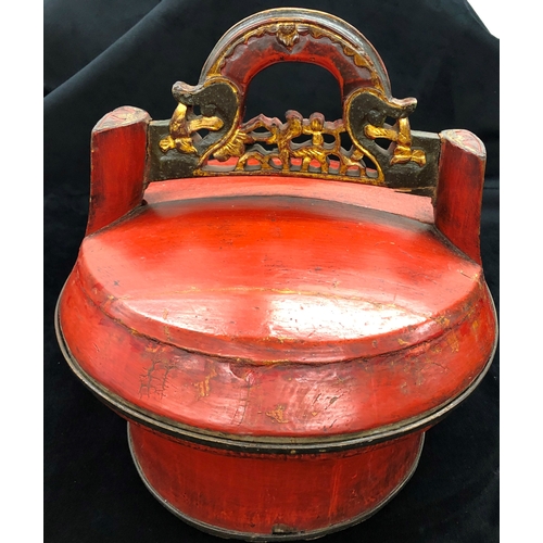 9003 - An Oriental wood box with half lid, red painted with gilt detail, 30cm high. (Some splits to wood on... 