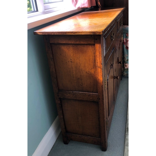 9008 - A Titchmarsh and Goodwin small oak cabinet with 2 drawers, 2 panel doors below enclosing interior sh... 