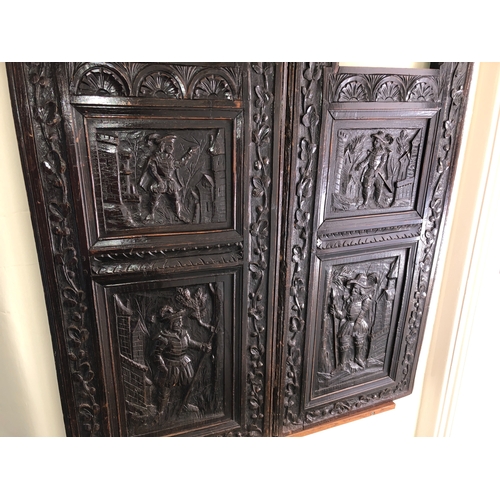 9013 - An antique carved wood hinged panel, 88.5cm wide, 128cm high, 2.7cm deep. (section of wood missing t... 