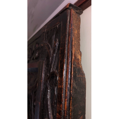 9013 - An antique carved wood hinged panel, 88.5cm wide, 128cm high, 2.7cm deep. (section of wood missing t... 