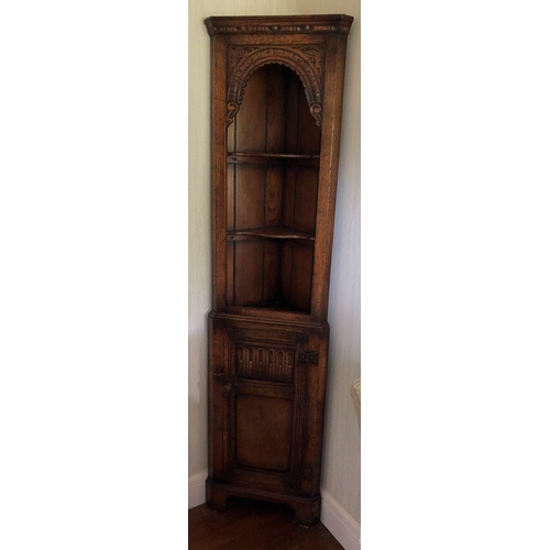 9016 - Titchmarsh and Goodwin oak corner cabinet, 2 upper shelves, lower carved panel door enclosing interi... 