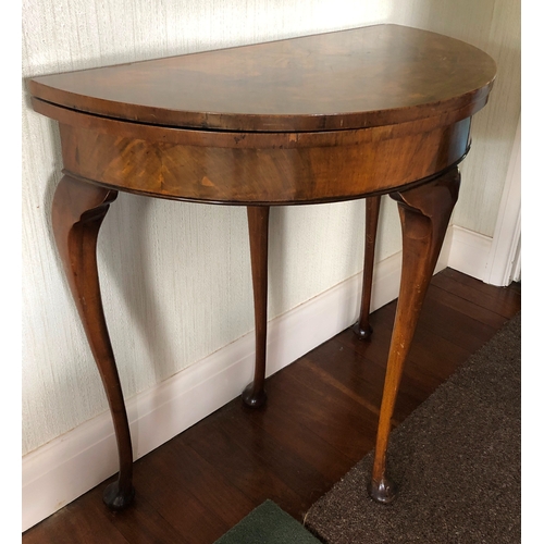 9017 - A burr walnut card table with semi-circular hinged top opening out circular top with brown felt, 4 l... 