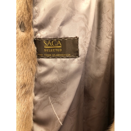 9021 - A Saga fully lined full length light brown mink coat with 2 pockets and matching belt, 116cm long si... 