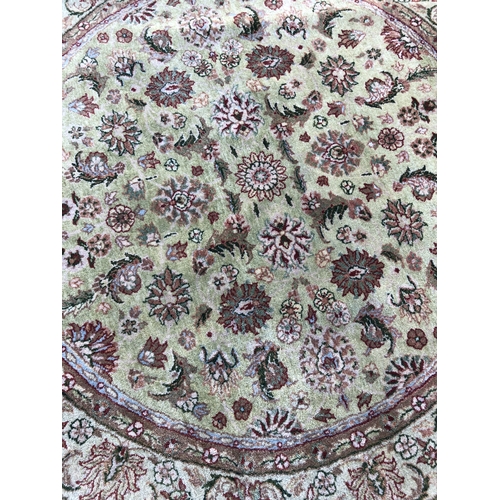 9031 - A Turkish circular rug on cream ground, 125cm diameter.