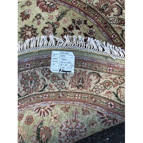 9031 - A Turkish circular rug on cream ground, 125cm diameter.