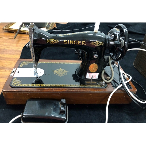 9050 - An electric Singer sewing machine No. K5935823, Serial No. EF099639 with accessories, pedal and cabl... 