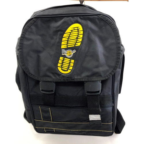 9054 - A black canvas rucksack with Dr. Martens logo. (As new)