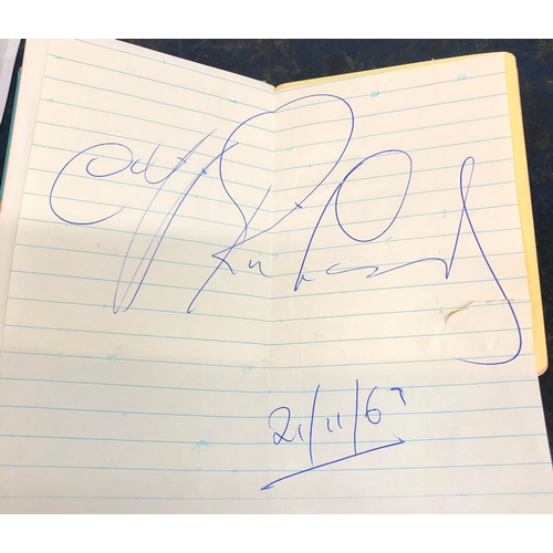 9059 - An autograph book with various signatures including Cliff Richard dated 21/11/69, Michael Craig, Pet... 