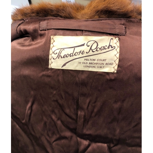 9060 - A brown short mink fur jacket, labelled Theodore Roach, 67cm long, sleeve 62cm long (hole in 1 sleev... 