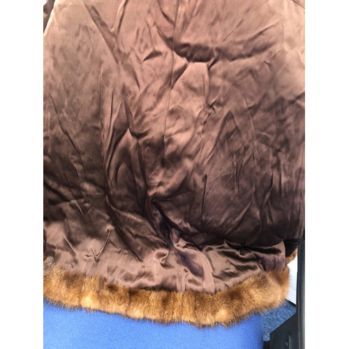 9060 - A brown short mink fur jacket, labelled Theodore Roach, 67cm long, sleeve 62cm long (hole in 1 sleev... 