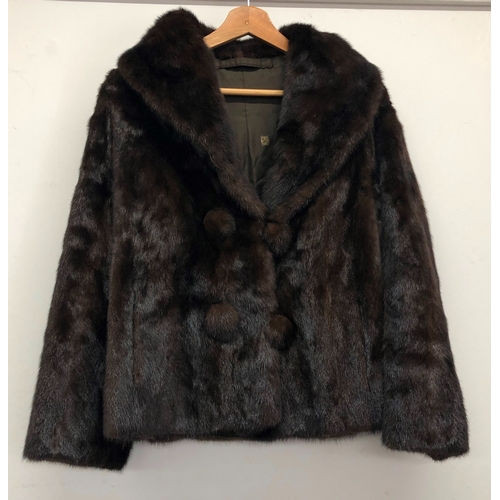 9061 - A short brown mink fully lined  fur coat with 4 buttons, 64cm long, sleeves 59cm long, size 10/12