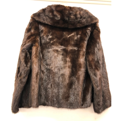 9061 - A short brown mink fully lined  fur coat with 4 buttons, 64cm long, sleeves 59cm long, size 10/12