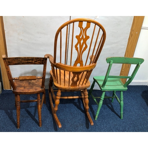 9064 - A pine rocking chair and 2 other chairs.