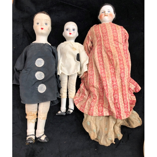 9065 - A china headed doll, 49cm long and 2 other dolls.