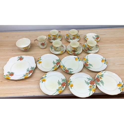 9091 - A Foley china tea service, 5 cups, 6 saucers, 6 side plates, 1 platter, 1 jug, 1 sugar bowl.