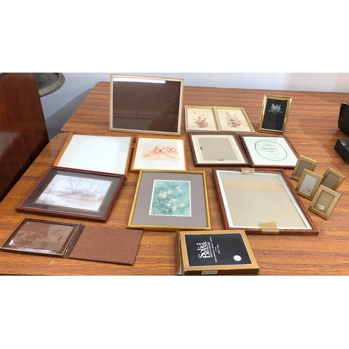 9102 - A solid brass photo frame 10cm x 15cm and a quantity of various other picture frames etc.