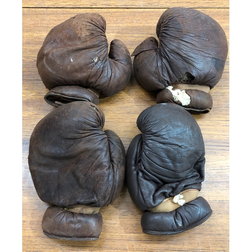 9105 - 2 pairs of vintage boxing gloves, both badly worn