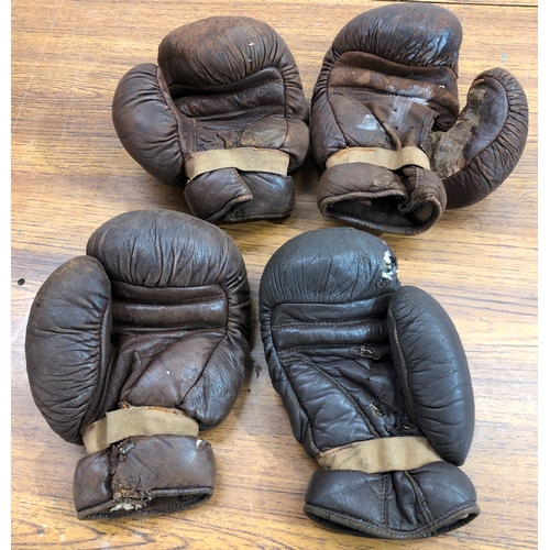 9105 - 2 pairs of vintage boxing gloves, both badly worn