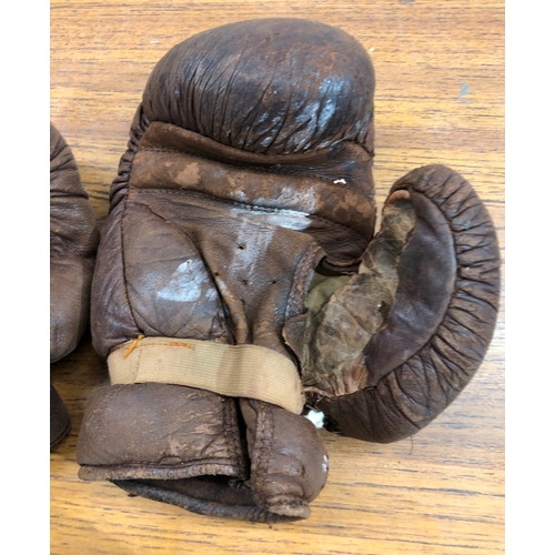 9105 - 2 pairs of vintage boxing gloves, both badly worn