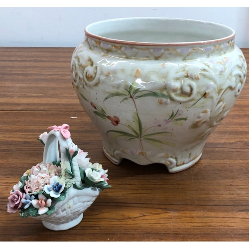 9113 - A china basket of flowers and a jardinière with floral pattern, 24cm high