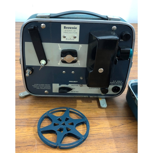 9114 - A Kodak Brownie Eight-61 projector in hard case, some damage to the case