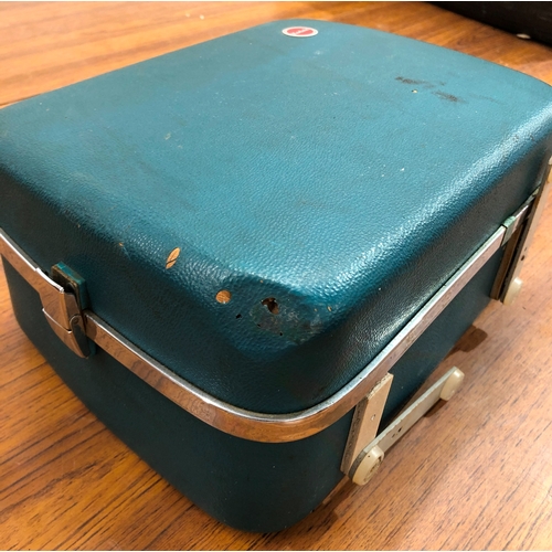 9114 - A Kodak Brownie Eight-61 projector in hard case, some damage to the case