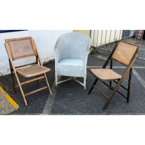 9119 - A pair of folding wooden chairs with cane seats and backs and a Lloyd Loom style tub chair