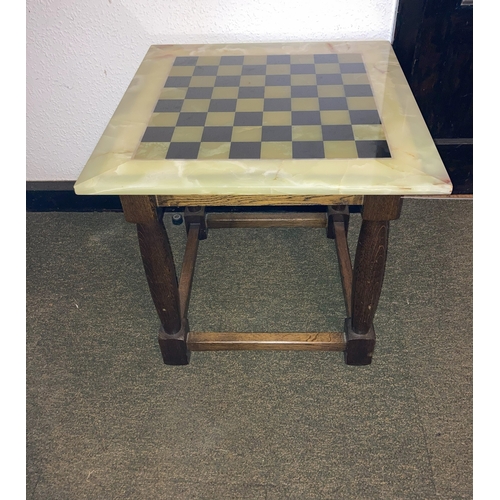 9127 - A marble chess table with detachable top, top 65 x 65cm. (slight chip to edge). This item is not hel... 