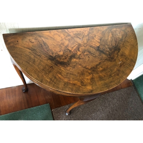 9017 - A burr walnut card table with semi-circular hinged top opening out circular top with brown felt, 4 l... 