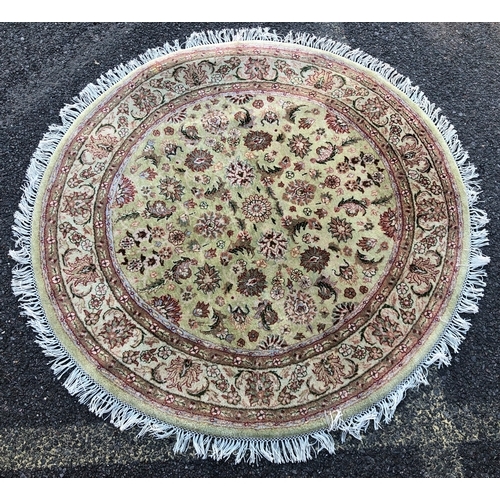 9031 - A Turkish circular rug on cream ground, 125cm diameter.