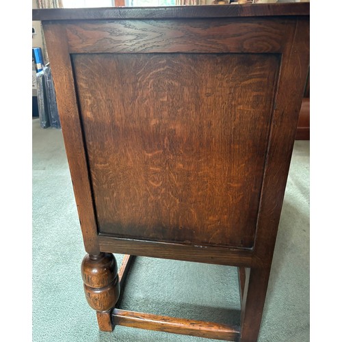 9231 - A1920's oak sideboard with 2 hinged doors with wooden knob handles, sitting either side of 3 central... 