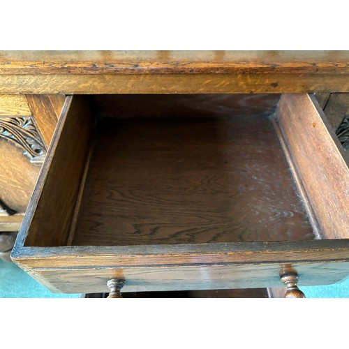 9231 - A1920's oak sideboard with 2 hinged doors with wooden knob handles, sitting either side of 3 central... 