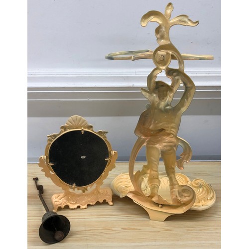 9140 - A modern painted metal umbrella stand with figure motif and scallop shaped base, 59cm high, a simila... 