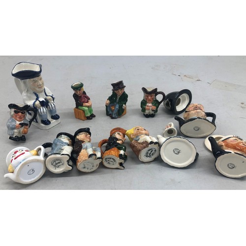 9149 - 4 miniature china teapots, 8 miniature china character jugs and a larger character jug