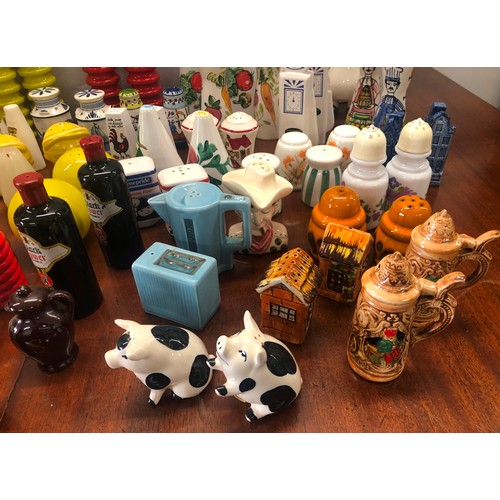 9159 - A collection of novelty condiment salt and pepper pots