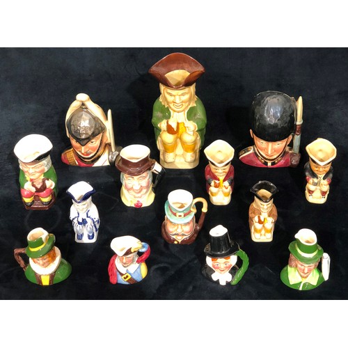 9180 - A Sylvac character jug of a soldier and 13 various small character jugs (14)