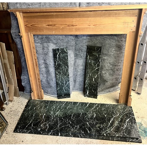 9193 - A pine fireplace with green marble base, raised carved floral, swag and reeded decoration, fireplace... 