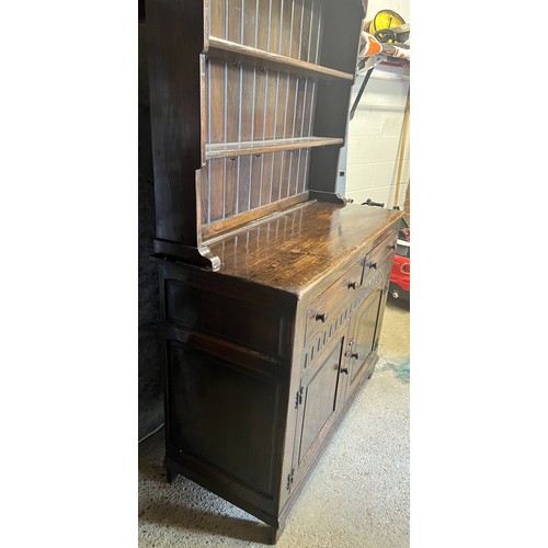 9196 - A good quality oak Welsh dresser with shelf back, 2 drawers above 2 doors with thumb pattern decorat... 