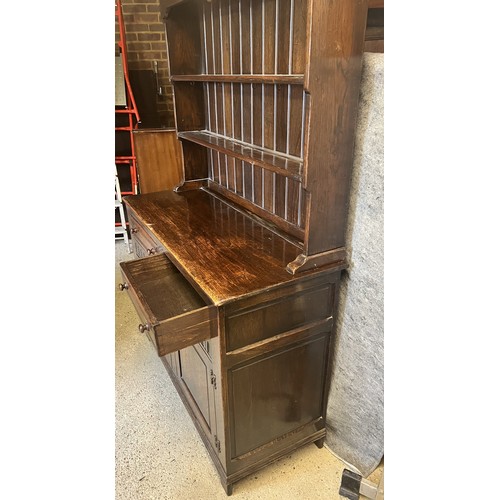 9196 - A good quality oak Welsh dresser with shelf back, 2 drawers above 2 doors with thumb pattern decorat... 