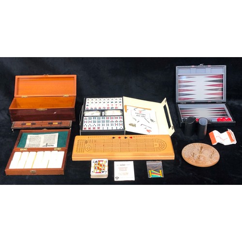 9212 - A plastic Mah-Jong set (boxed), a set of dominoes (boxed), a backgammon set (boxed), 3 various cribb... 