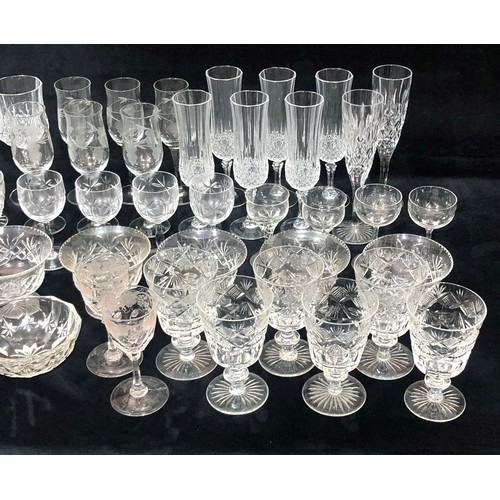 9217 - A set of 6 cut glass trumpet shaped wine glasses, 6 taller wine glasses and a quantity of various od... 