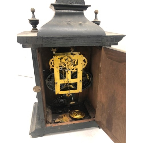 9240 - An ebonised style 8-day striking mantel clock with turned finials, gilt dial with Arabic numerals, 4... 